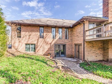 Back showing walk-out and patio