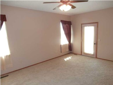 Spacious master bedroom with vaulted ceiling.