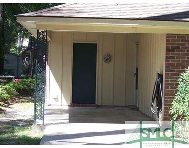 Exterior Front. Carport and laundry room.