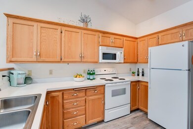 The kitchen features beautiful new luxury plank vi