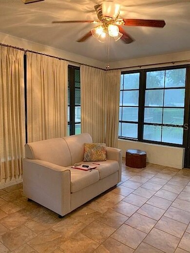 Florida room features ceramic tile, vinyl windows 