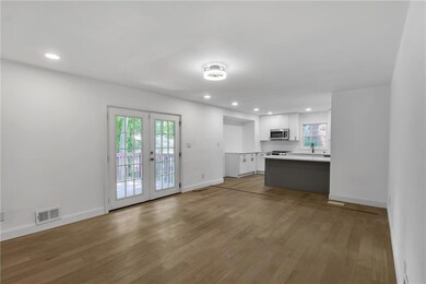 Unfurnished living room with light wood-type floor