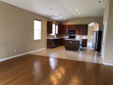 Open floor plan between kitchen and spacious famil