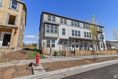View of front of property featuring stucco siding and a fenced front yard