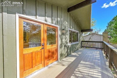 Doorway to property with board and batten siding, 