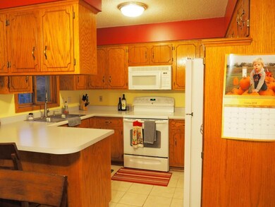 Kitchen has counter seating, loads of counter and 