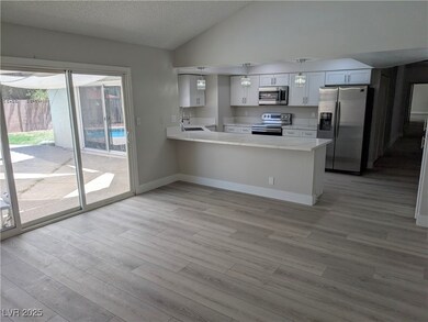Kitchen featuring stainless steel appliances, ligh