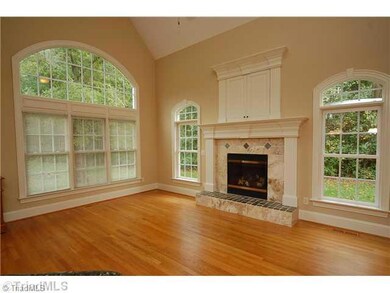Den/Family/Great Room. This Den/Family Room has a great gas log fireplace, palladium windows and hardwood floors.  It is open to the kitchen area.