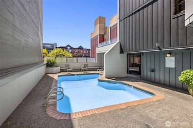 Outdoor swimming pool on 2nd floor. Jacuzzi is through doors on the right as well as the sauna.
