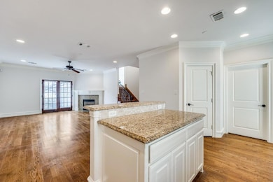 Kitchen featuring light wood finished floors, orna