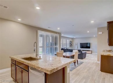 Kitchen with baseboards, light countertops, light