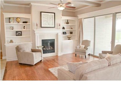 Drop-beamed ceiling and built-in bookcases, floor-