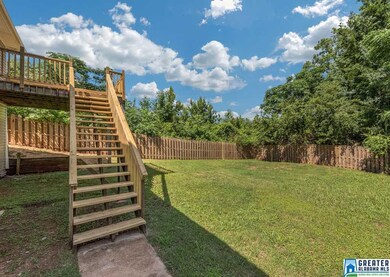 The nice deck leads down to the spacious fenced-in