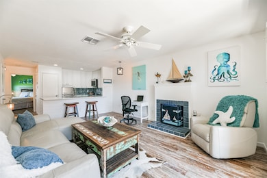 Open concept coastal living room and kitchen