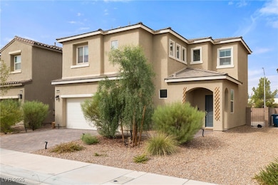 View of front of property with stucco siding, decorative driveway, a garage, and a tile roof