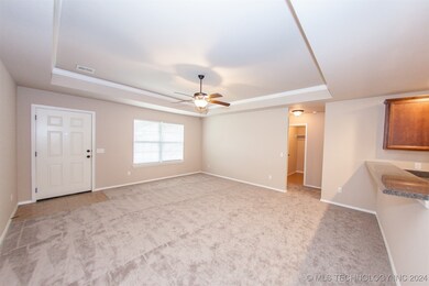 Living room showing front door and window