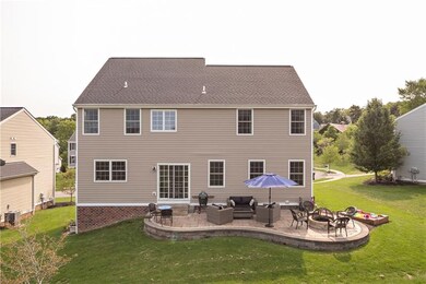 Beautiful Custom stone patio with built in stone firepit for entertaining family and friends.