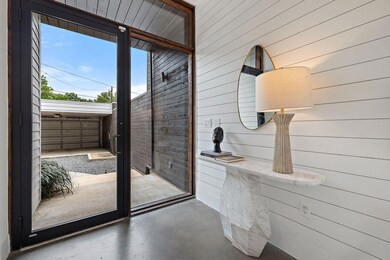Doorway with wood walls and concrete floors