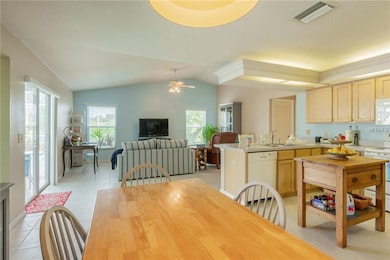 Kitchen and dining nook overlook the spacious fami
