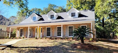 New england style home with a porch