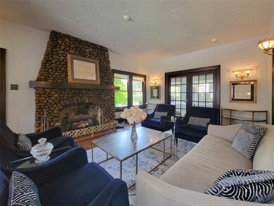 The stone gas fireplace with it's over sized woode