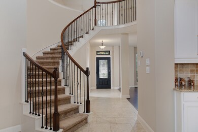 Stunning spiral staircase greets you before walkin