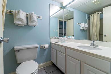 Bathroom featuring tile patterned floors, a shower