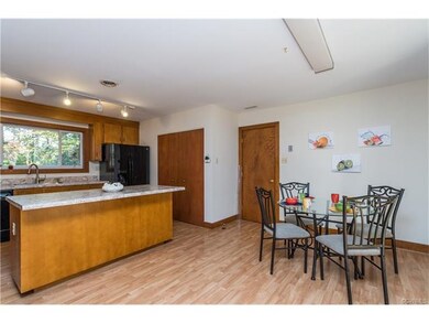 EAT-IN KITCHEN WITH NEW COUNTERTOPS AND STOVE
