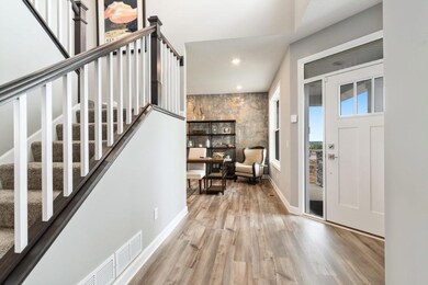 This wide-open foyer is very welcoming to guests and with the spacious design, it supports many furnitre options, such as benches and accent table, etc...  Photos are of a decorated model home and finishes will vary.