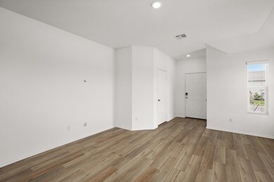 Empty room featuring wood finished floors, recess