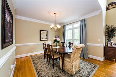Dining Room.  Lovely moldings add to the quality f