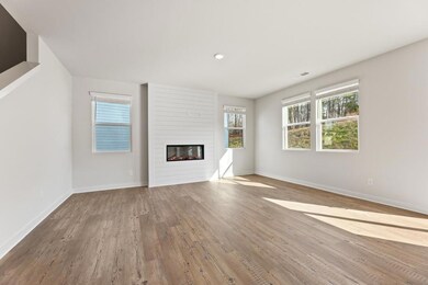 Unfurnished living room with wood finished floors,