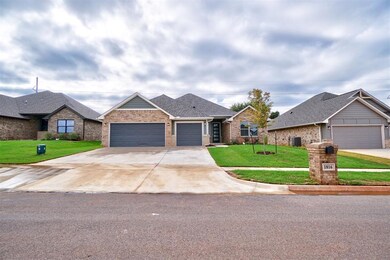 View of front of home featuring a garage, a front 