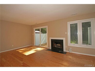 The great room has new hardwood floor and a firepl