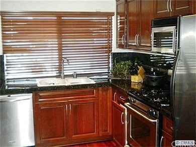 Gorgeous kitchen with wood floors, granite counter