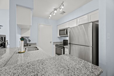 ... the beautifully remodeled kitchen.  The door l