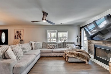 Living area with hardwood / wood-style floors, cro