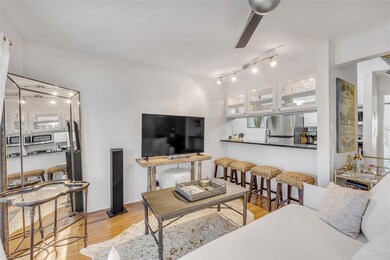 Living area featuring wood finished floors and ba