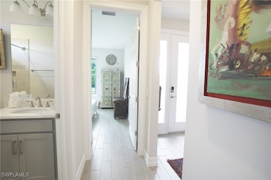 Hallway featuring sink