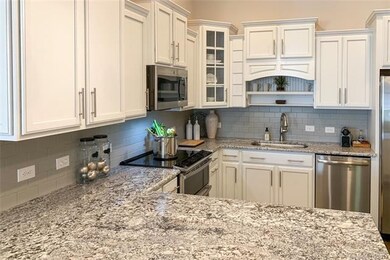 KITCHEN:Photos may be different than model