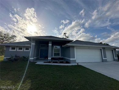 View of front of home featuring a garage, a front