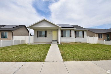 Single story home with solar panels