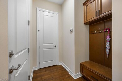 Mudroom with dark wood-type flooring