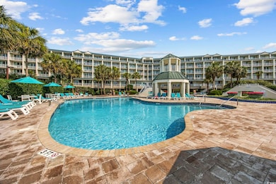 Community pool featuring a gazebo and a patio area