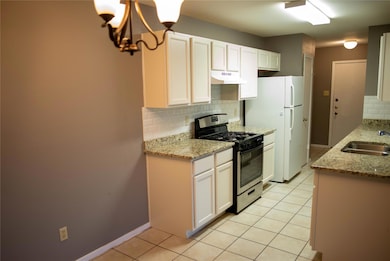 Kitchen with stainless steel gas stove, under cab