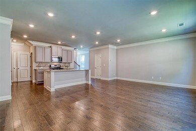 Kitchen featuring dark wood-style floors, a center