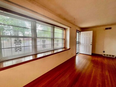 Empty room with dark wood-type flooring