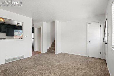 Unfurnished living room featuring carpet flooring
