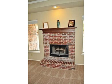 Other. Handsome brick fireplace in living room. Ma