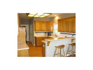 Kitchen with corian counters and hardwoods